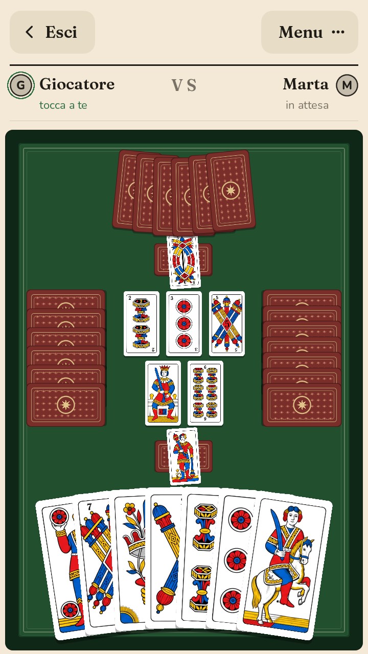 Lo scopone a coppie: il compagno di fronte, gli avversari ai lati, sette carte in mano